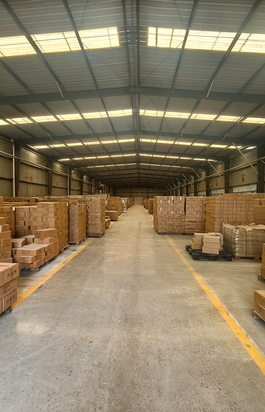 Warehouse aisle with export cartons for glass bottle delivery