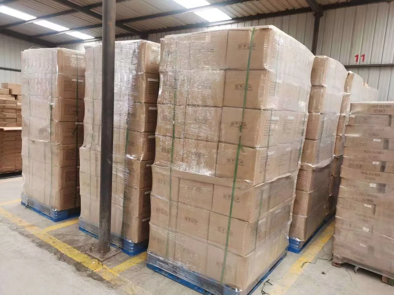 Palletized export cartons wrapped for glass bottle shipment