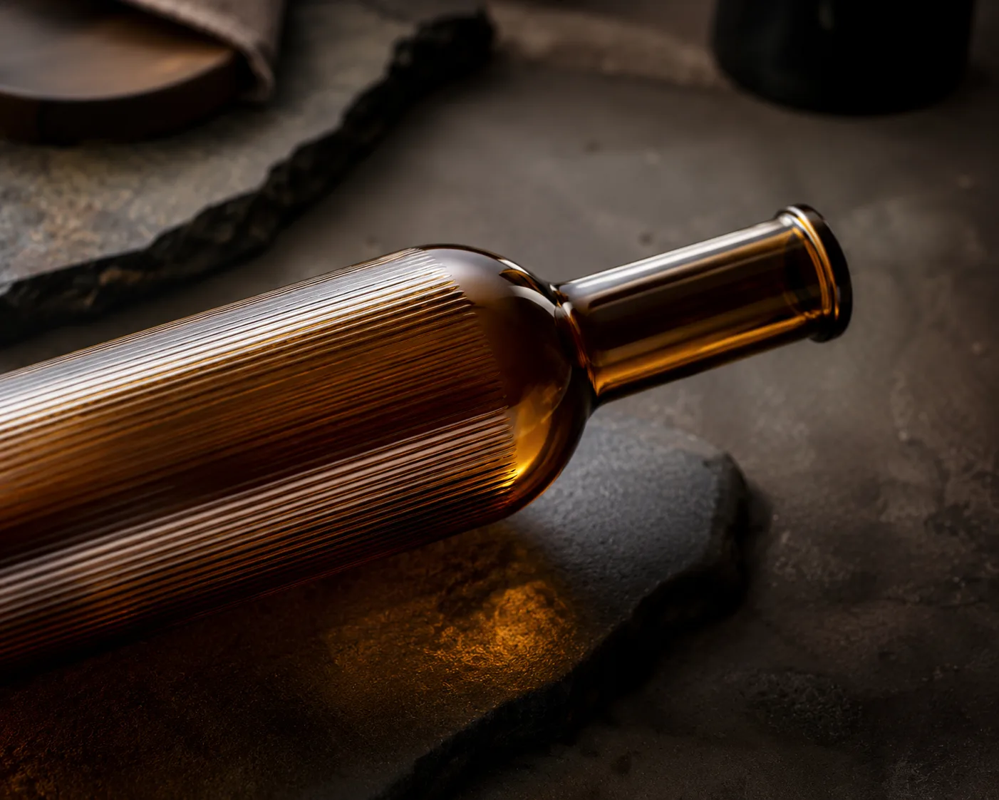 Amber Glass Dorica Oil Bottle in a coordinated amber glass product presentation.