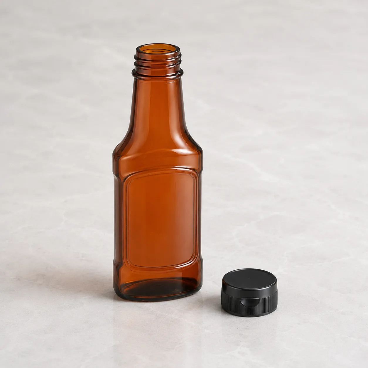 Angled side view of Amber Glass Sauce Bottle showing the outer profile
