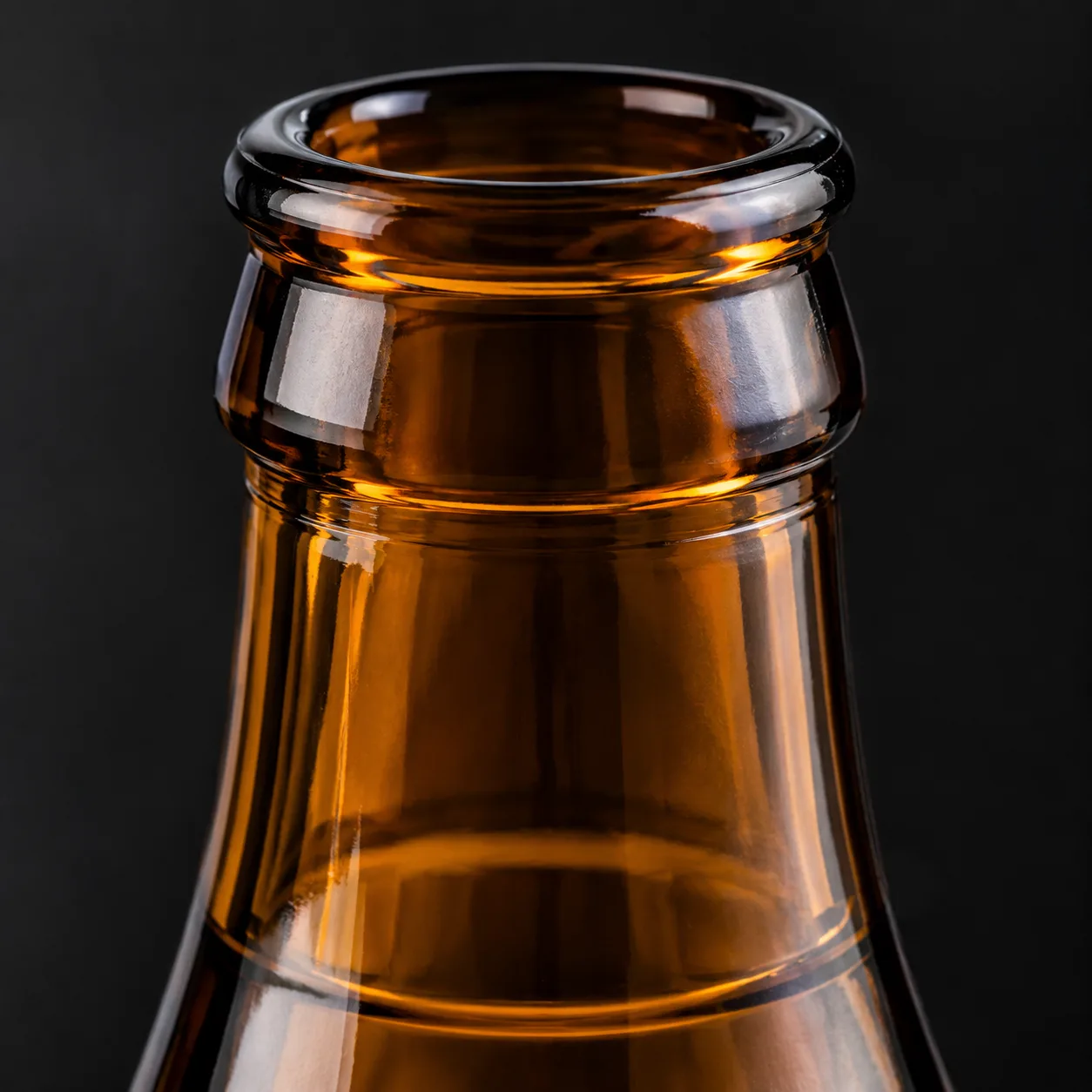 Close view of Amber Glass Soft Drink Bottle showing label area and print / coat / label