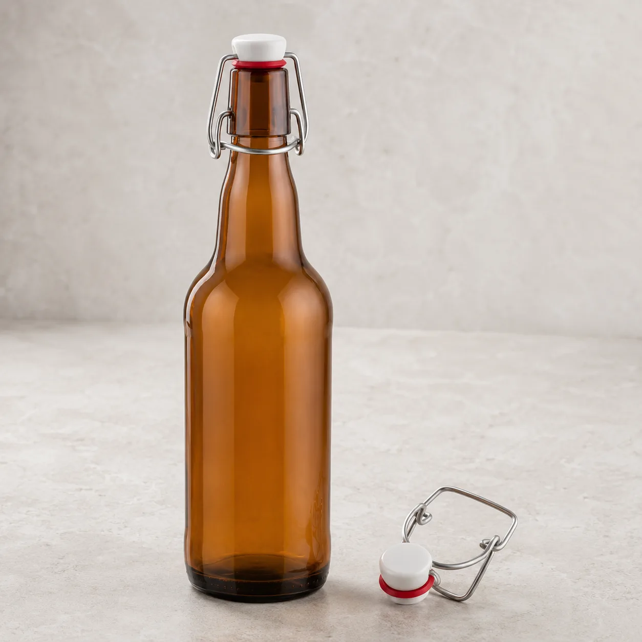 Angled side view of Amber Glass Swing-Top Beverage Bottle showing the outer profile