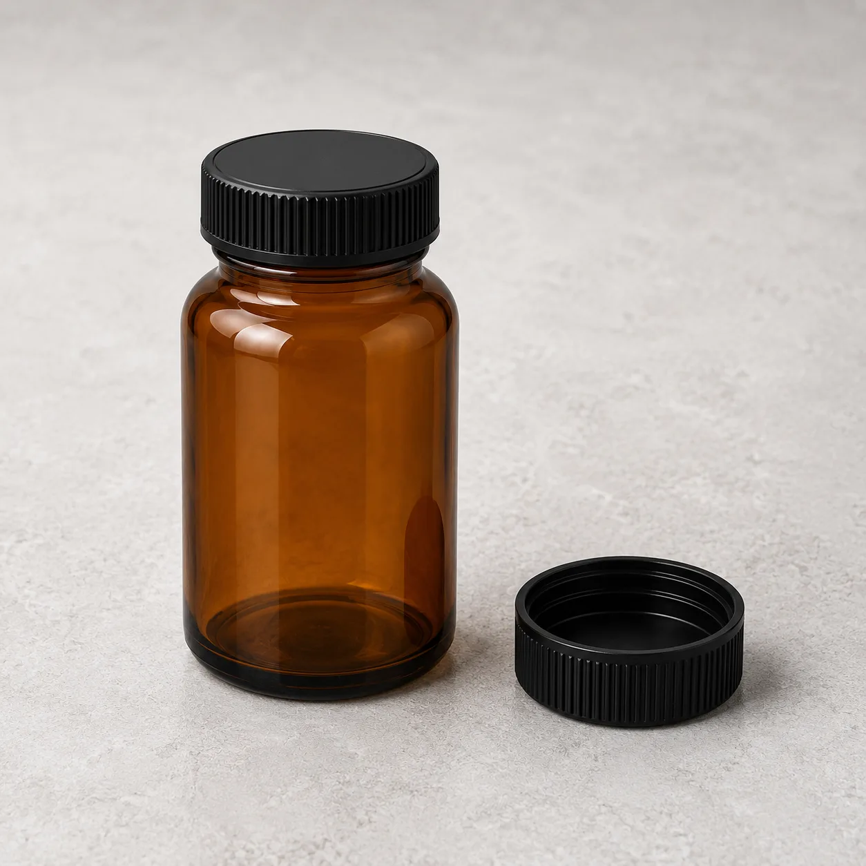 Angled side view of Amber Glass Tablet and Capsule Bottle showing the outer profile