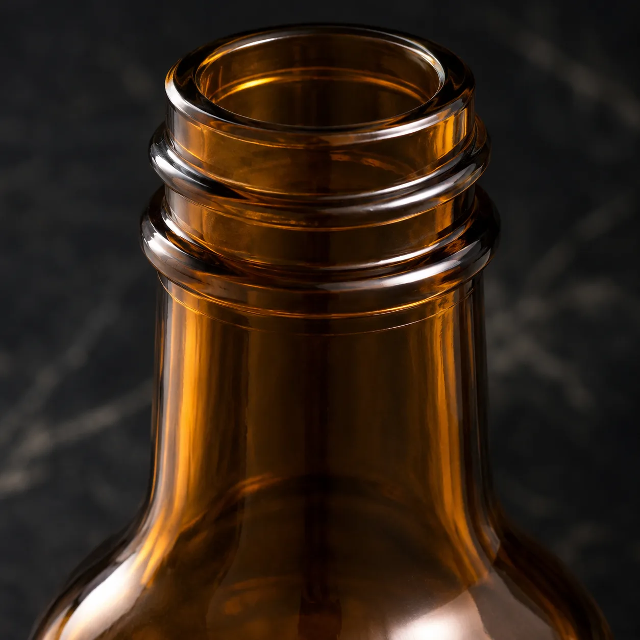 Close view of Amber Glass Vinegar Bottle showing label area and print / coat / label