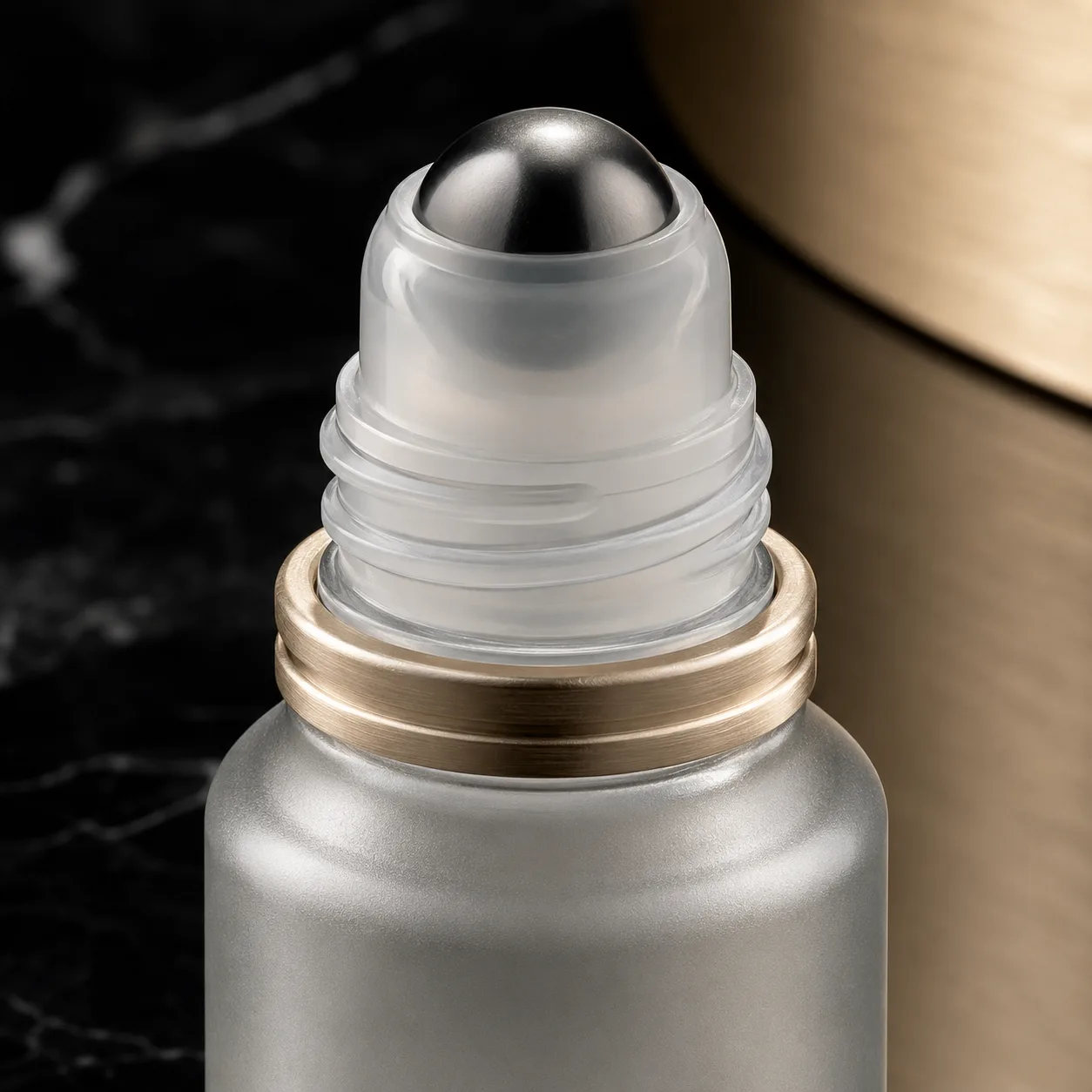 Close view of Glass Cosmetic Roll-On Bottle showing closure area and print / coat / label