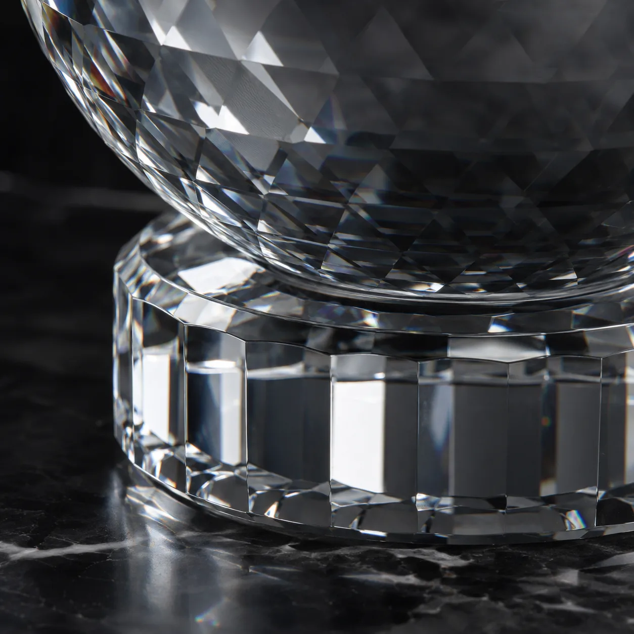 Close view of Cut Glass Decorative Orb showing base detail and faceted surface detail