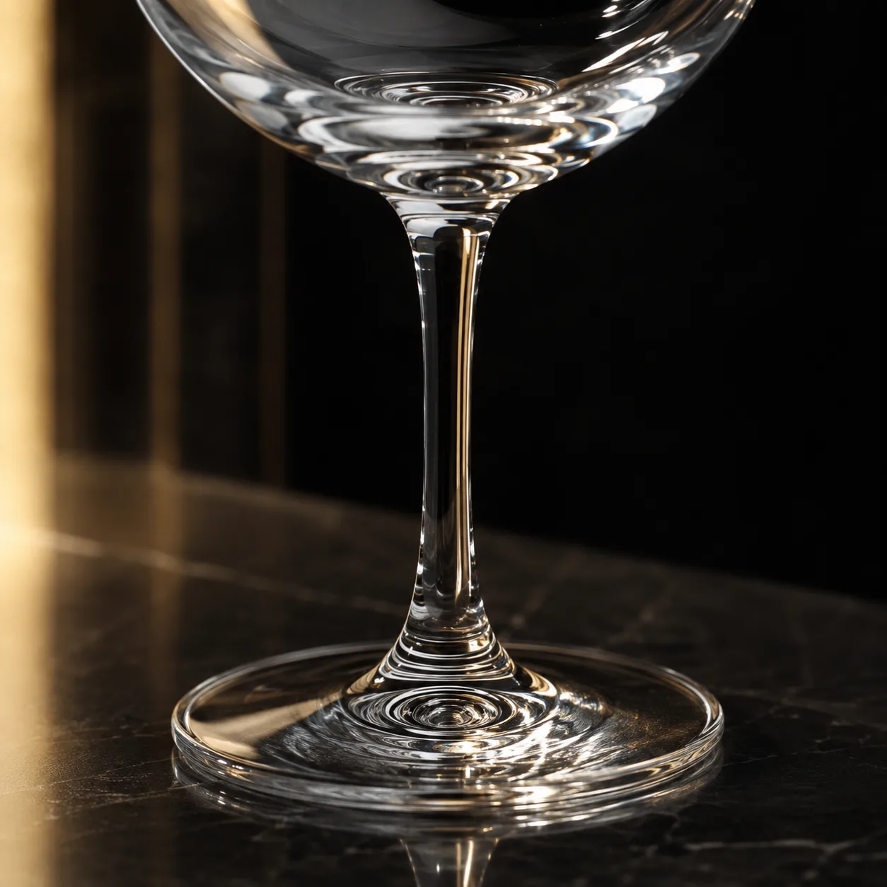Close view of Gin and Tonic Glass showing stem or base and logo print / decal