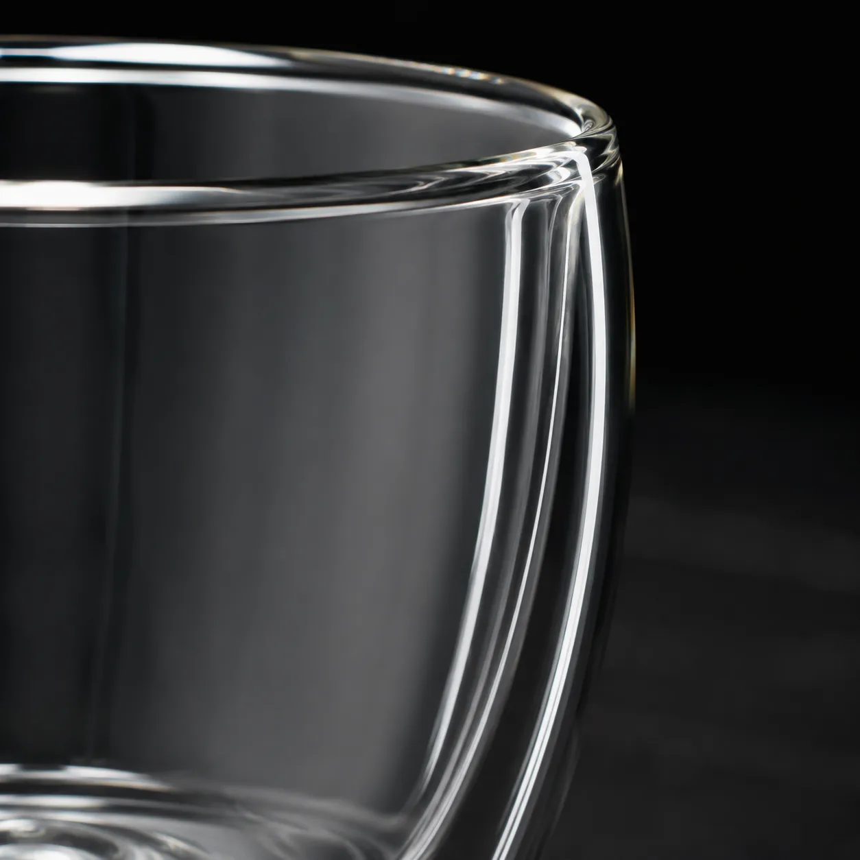 Close view of Glass Beverage Cup showing stem or base and logo print / decal