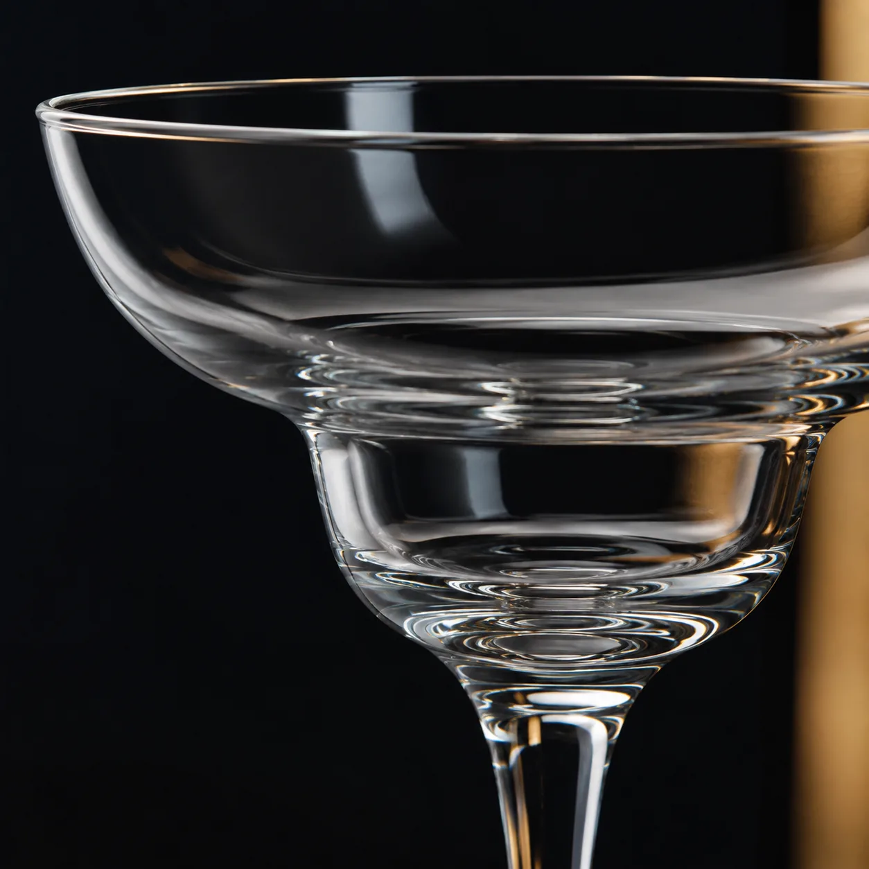 Close view of Margarita Glass showing stem or base and logo print / decal