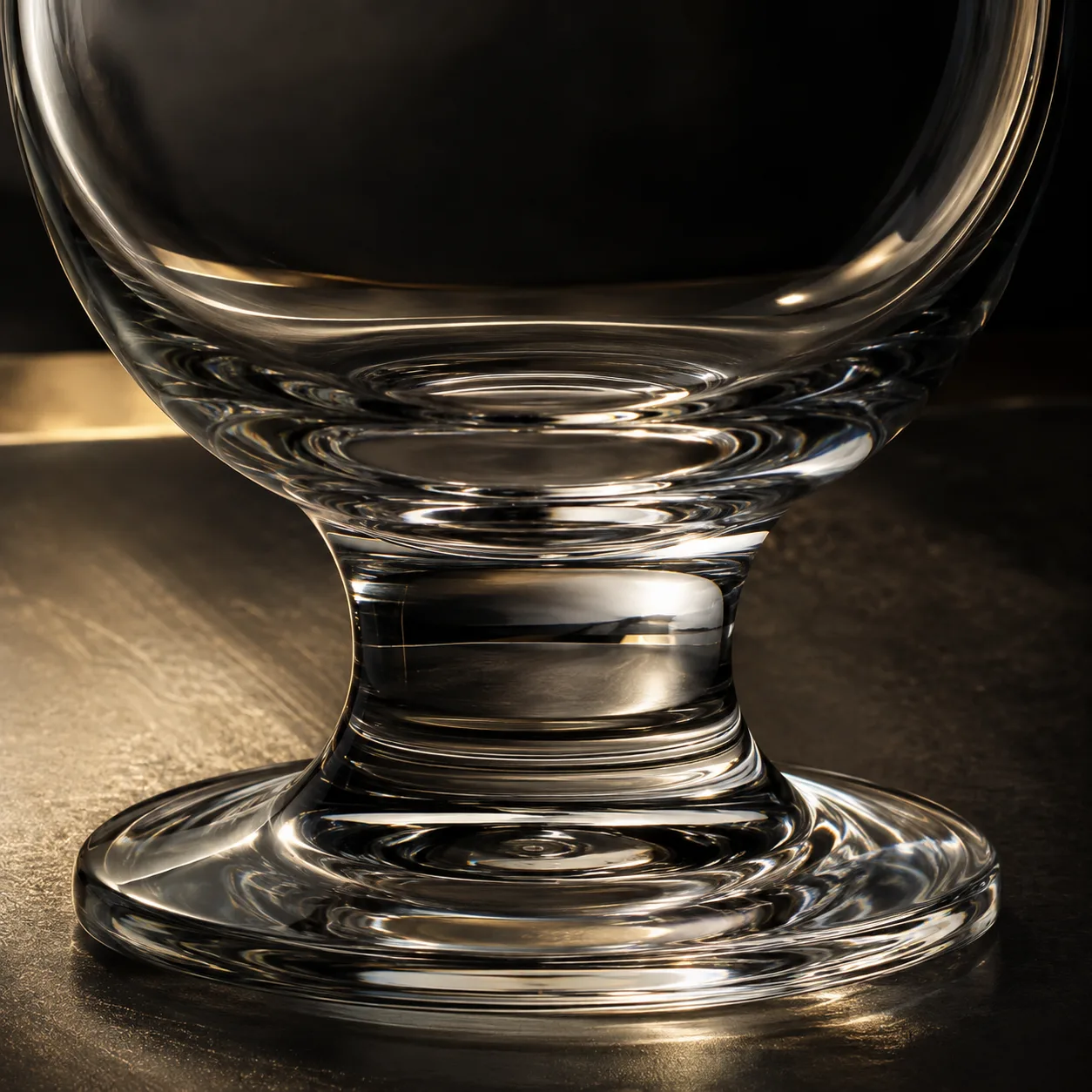 Close view of Tulip Beer Glass showing stem or base and logo print / decal