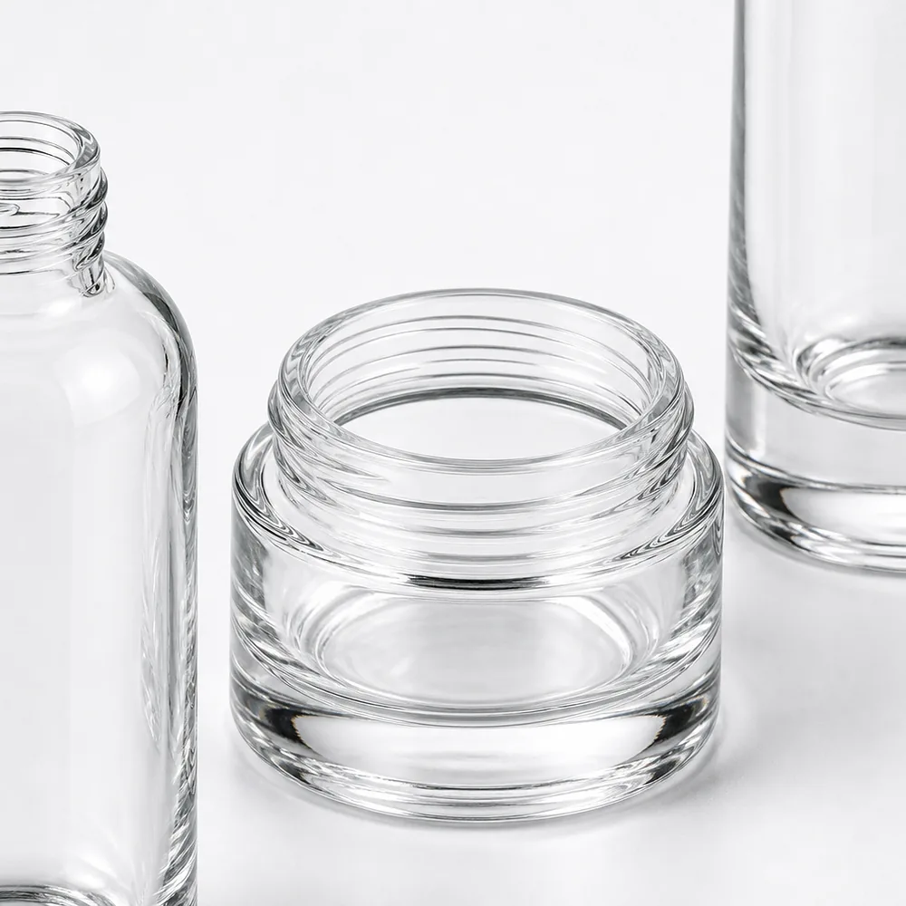 Oval Shoulder Cosmetic Bottle and Cream Jar Set with pump, dropper and cream jar lid - packing view