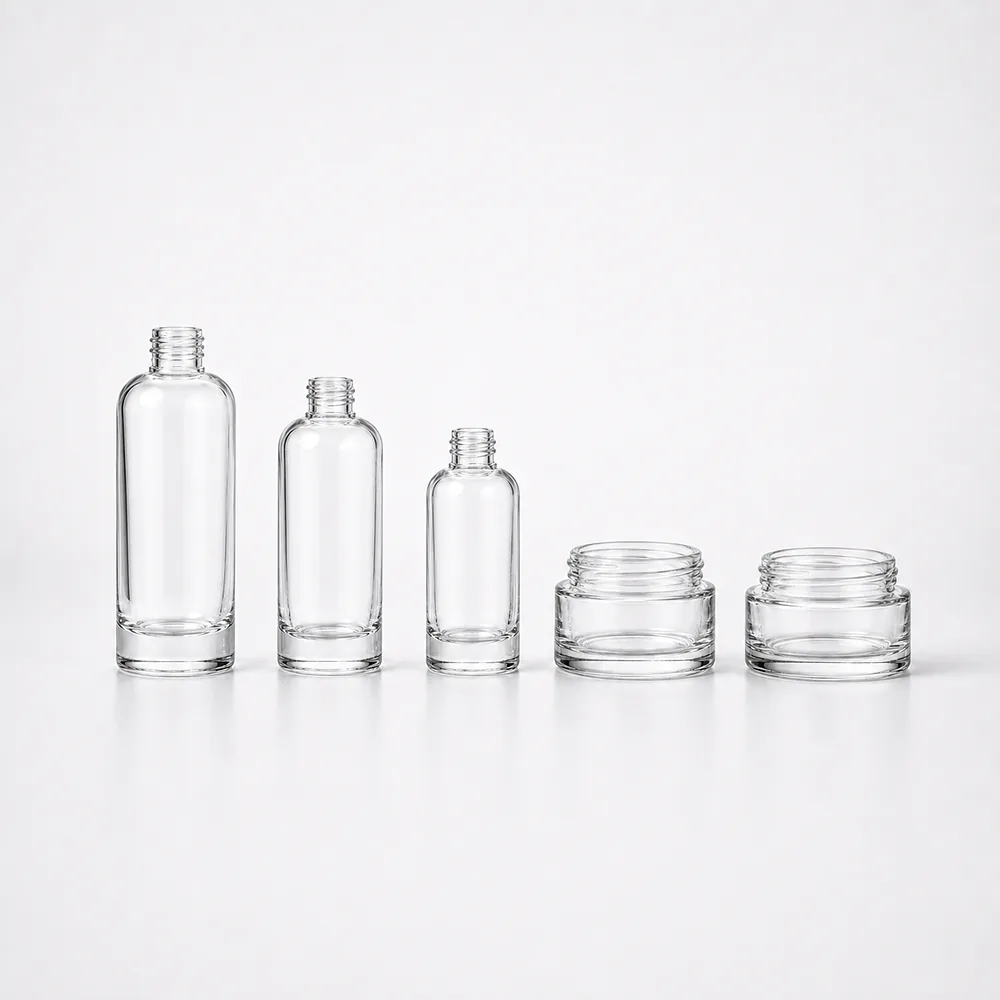 Oval Shoulder Cosmetic Bottle and Cream Jar Set with pump, dropper and cream jar lid - front view