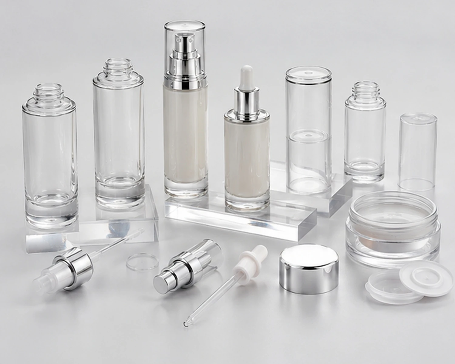 accessories detail image of Cylindrical Serum Bottle and Cream Jar Set showing caps, pumps, jar lids or cosmetic packaging components