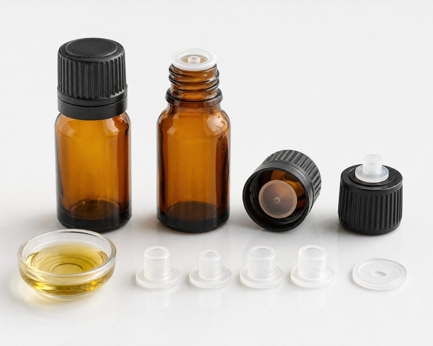 Essential oil bottle closure accessories showing plug, cap and bottle matching details