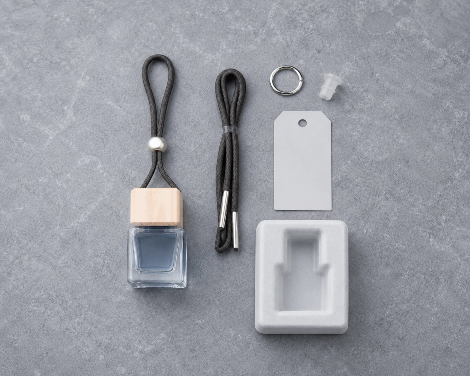 accessory detail image of Square Car Diffuser Bottle showing closure, label and packaging components